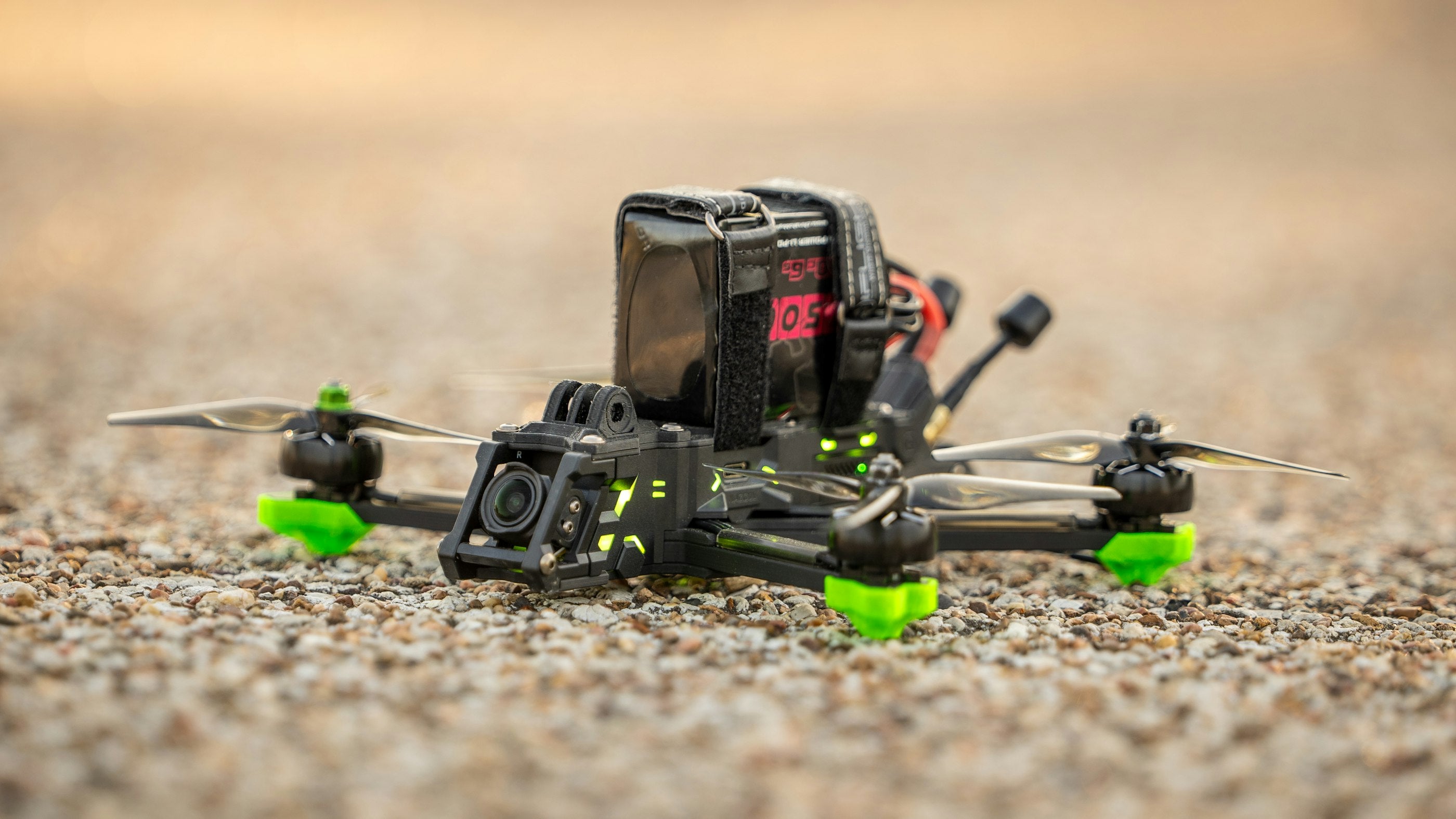 FPV freestyle quad staged on gravel before a flight session